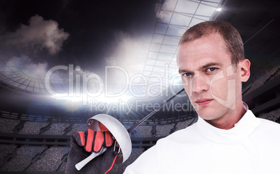 Composite image of close-up of swordsman holding fencing sword