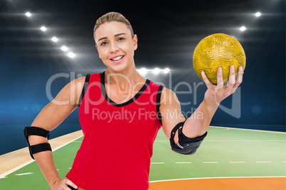 Composite image of female athlete with elbow pad holding handbal