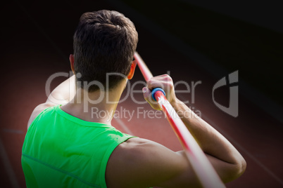 Composite image of rear view of sportsman practising javelin thr