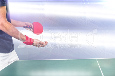 Mid section of athlete man playing table tennis