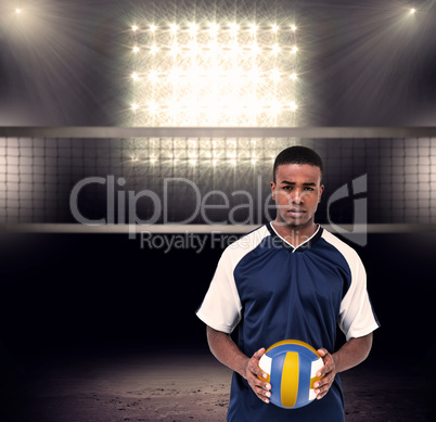 Composite image of sportsman holding a volleyball