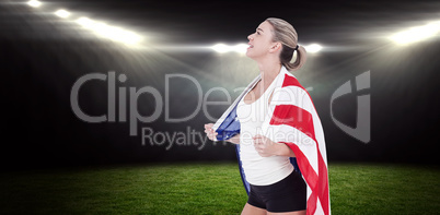 Composite image of female athlete with american flag on her shou