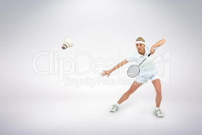 Composite image of badminton player playing badminton