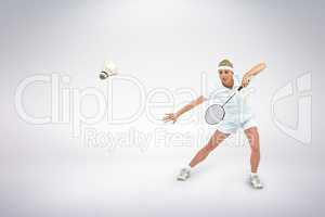 Composite image of badminton player playing badminton