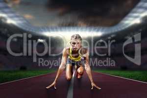 Composite image of sportswoman in the starting block