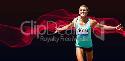 Composite image of sportswoman finishing her run