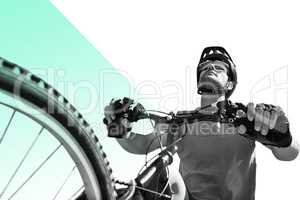 Composite image of man cycling with mountain bike