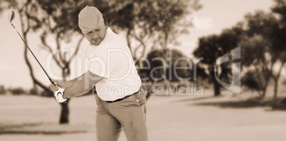 Composite image of golf player taking a shot