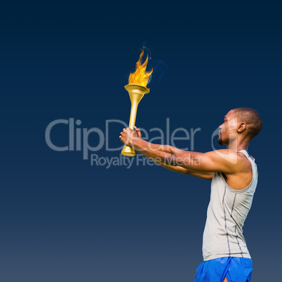 Composite image of profile view of sportsman holding a cup