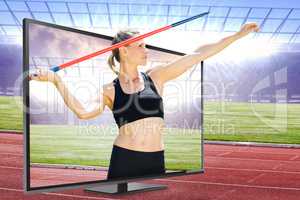 Composite image of front view of sportswoman practising javelin