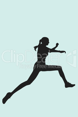 Composite image of profile view of sportswoman jumping