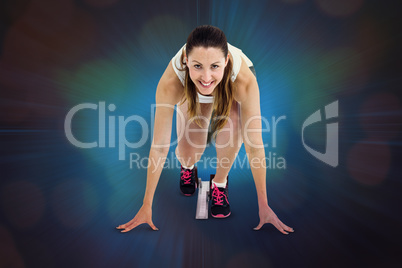 Composite image of athlete woman in ready to run position