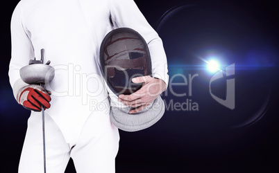 Composite image of swordsman holding fencing mask and sword