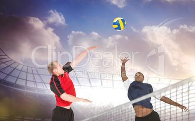 Composite image of sportsmen are playing volleyball