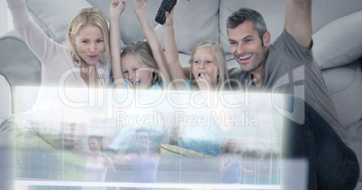 Composite image of family are watching running on television