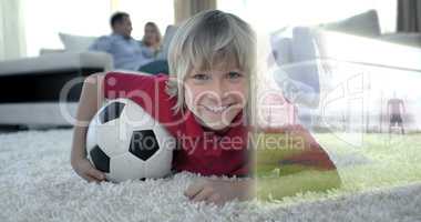 Composite image of cute soccer fan is watching soccer match on t