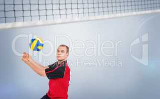 Composite image of sportsman posing while playing volleyball