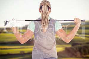 Composite image of pretty blonde playing golf rear view