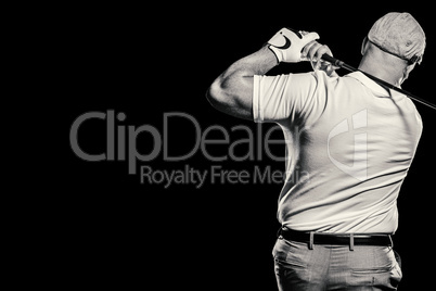 Portrait of golf player taking a shot
