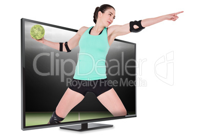 Composite image of female athlete with elbow pad throwing handba