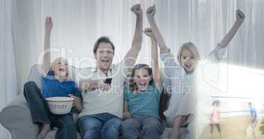 Composite image of family watching sport on television and raisi