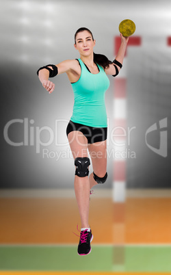 Composite image of female athlete with elbow pad throwing handba