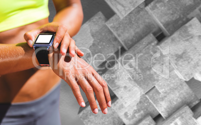 Composite image of close up on a sportswoman wearing a connected