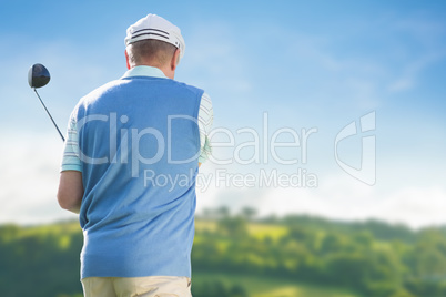 Rear view of man playing golf