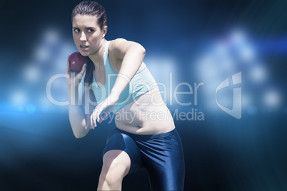 Composite image of sportswoman practising the shot put