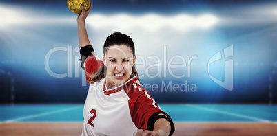 Composite image of sportswoman throwing a ball