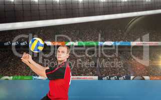 Composite image of sportsman posing while playing volleyball