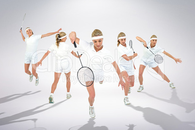 Composite image of badminton player playing badminton