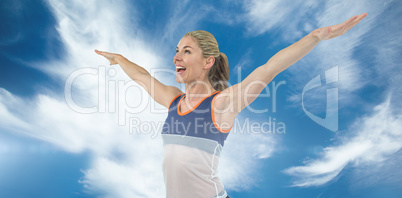 Composite image of excited female athlete with arms outstretched