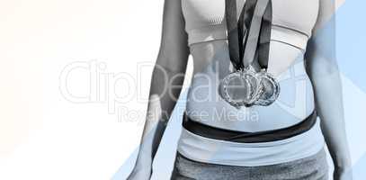 Composite image of sportswoman chest with medals