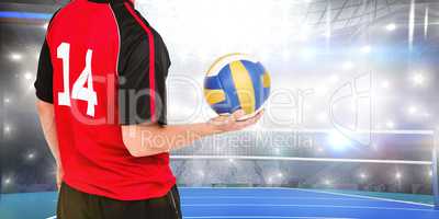 Composite image of sportsman holding a volleyball