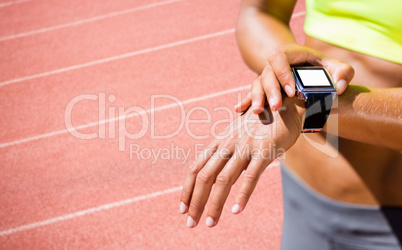 Composite image of close up on a sportswoman wearing a connected