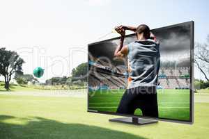 Composite image of rear view of sportsman practising hammer thro