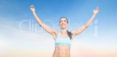 Composite image of portrait of happy sportswoman is raising arms