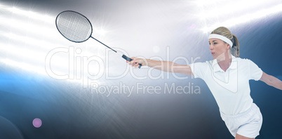 Female athlete playing badminton