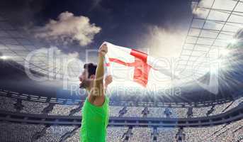 Composite image of profile view of sportsman holding an england