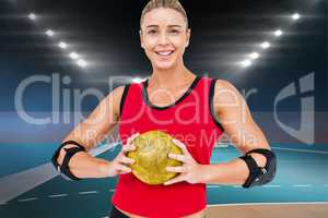 Composite image of female athlete with elbow pad holding handbal