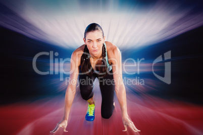 Composite image of sporty woman in the starting block