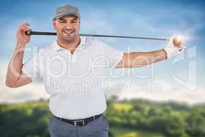 Composite image of portrait of golf player holding a golf club w