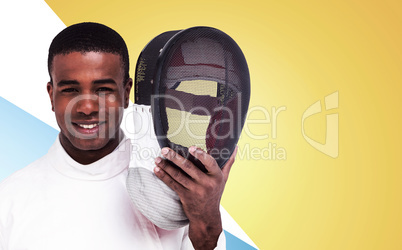 Composite image of swordsman holding fencing mask