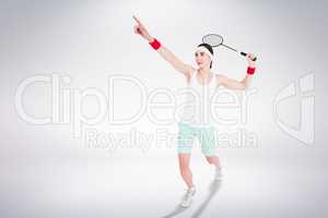 Composite image of female athlete playing badminton