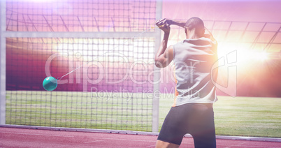 Composite image of rear view of sportsman practising hammer thro