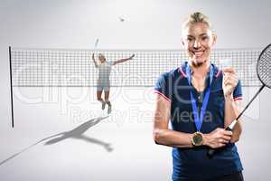 Composite image of badminton player posing with a medal