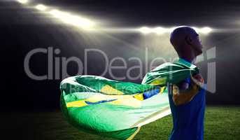 Composite image of profile view of sportsman holding a brazilian