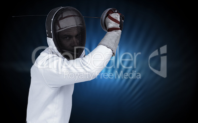 Composite image of man wearing fencing suit practicing with swor