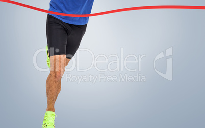 Composite image of male athlete running on white background